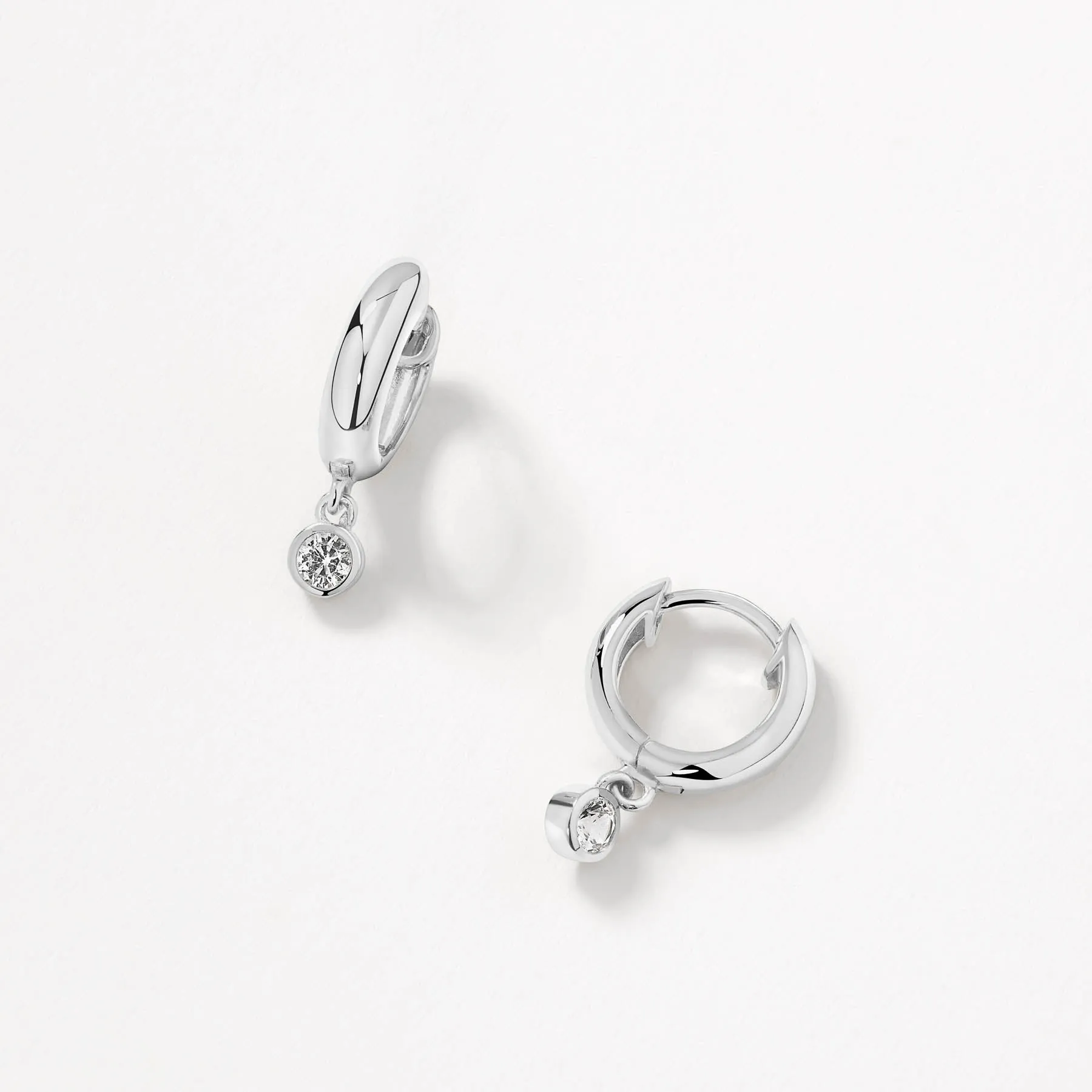 White Topaz Round Drop Charm Huggies in Silver